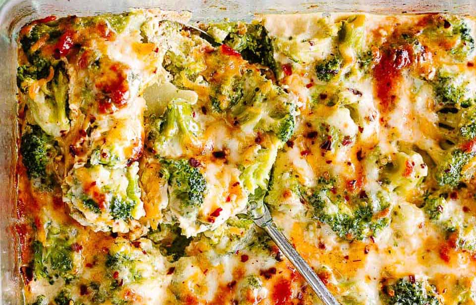 Broccoli cheese casserole baked in a glass dish with a bubbly golden crust