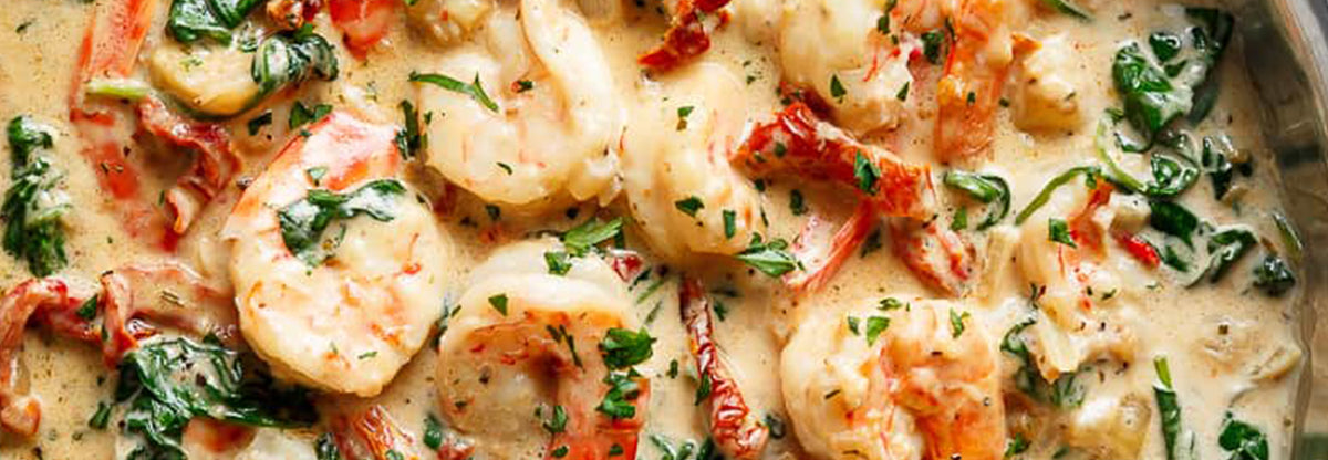 Creamy Tuscan garlic chicken with herbs in a skillet